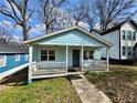 Lovely one-story home with light blue siding, a cozy front porch, and well-kept lawn at 958 Fern Se Ave, Atlanta, GA 30315