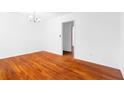 Inviting living room featuring gleaming hardwood floors and neutral paint at 1893 Kenwood Se Rd, Smyrna, GA 30082