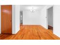 Light-filled living room boasts classic hardwood floors and neutral walls at 1893 Kenwood Se Rd, Smyrna, GA 30082