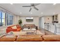 The living room offers an open layout, modern furniture and a wet bar at 300 Peachtree Ne St # 6H, Atlanta, GA 30308