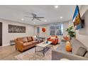 Inviting living room features a comfortable leather sofa and view of the city at 300 Peachtree Ne St # 6H, Atlanta, GA 30308