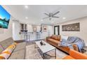 The living room features a stylish sofa, wet bar, and neutral decor at 300 Peachtree Ne St # 6H, Atlanta, GA 30308
