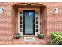 Elegant front door with glass panels, sidelights, and a decorative 'HOME' welcome mat at 2976 Wilsons Crossing Ct, Decatur, GA 30033