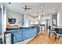 Open-concept living space with hardwood floors, a couch, and a view of the kitchen at 1100 Arkwright Se Pl # B, Atlanta, GA 30316