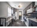 Updated kitchen featuring modern cabinets, stainless steel appliances, and stylish backsplash at 1475 Elizabeth Ln, Atlanta, GA 30344