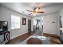 Bright living room with hardwood floors, neutral paint, and a modern ceiling fan at 1475 Elizabeth Ln, Atlanta, GA 30344