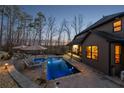 Backyard oasis with a sparkling pool, lounge chairs, and lush landscaping perfect for relaxation at 101 Bevil Ridge Se Rd, Emerson, GA 30137