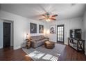 Inviting living room with modern decor, hardwood floors, and a comfortable sofa at 1475 Elizabeth Ln, East Point, GA 30344
