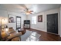 Inviting living room featuring hardwood floors, a comfortable sofa, and natural light at 1475 Elizabeth Ln, East Point, GA 30344
