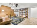 Stylish living space with a comfortable couch, patterned rug, decorative shelving, and bright, inviting lighting at 198 Ponce De Leon Ne Ave # 2A, Atlanta, GA 30308