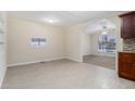 Open dining area featuring tile floors, large windows and access to kitchen at 1899 Lathrop Se St, Atlanta, GA 30315