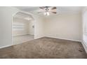 Inviting living room boasting neutral carpet, fresh paint, and a ceiling fan at 1899 Lathrop Se St, Atlanta, GA 30315