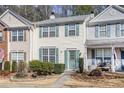 Charming two-story townhome with light yellow siding and a welcoming front entrance at 2280 Whitestone Pl, Alpharetta, GA 30005