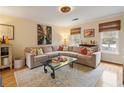 Comfortable living room featuring a large sectional sofa, hardwood floors, and bright natural light at 1101 Collier Nw Rd # U6, Atlanta, GA 30318