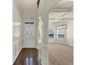 Elegant foyer leads into a dining area with modern lighting and wainscoting detail at 3777 Shady Maple Dr, Lithonia, GA 30038