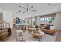 Open-concept living room seamlessly flows into a dining area and kitchen with a modern design at 130 Briargate Dr, Johns Creek, GA 30097