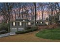 Charming home with a two-car garage and a lush front yard at 3902 Sheldon Ne Dr, Atlanta, GA 30342