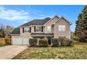 Charming two-story home featuring a two-car garage and a combination of siding and stone accents at 4260 Mason Creek Rd, Winston, GA 30187