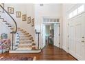 Beautiful staircase with patterned carpet, white railings, and dark wood floors at 4610 Wynmeade Ne Park, Marietta, GA 30067