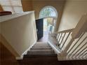 View of entryway stairs leading to front door with transom window providing natural light at 2655 Fort Apachee Trl, Dacula, GA 30019
