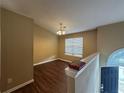 Inviting space with hardwood floors, a ceiling fan and a light fixture at 2655 Fort Apachee Trl, Dacula, GA 30019