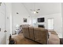 Inviting living room featuring a fireplace, vaulted ceiling, and neutral décor at 403 Keys Ferry Rd, Mcdonough, GA 30252