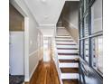 Inviting foyer with hardwood floors and staircase, showcasing the home's interior layout at 5629 Kingsport Dr # 11, Atlanta, GA 30342