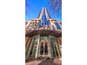 The entrance of the Spire Midtown building with a modern glass facade at 860 Peachtree Ne St # 917, Atlanta, GA 30308