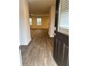 Inviting entryway with wood-look floors and view to the living room at 903 Jackson Oak Place, Villa Rica, GA 30180