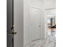 Bright hallway features white marble floors leading to the living room at 2828 Peachtree Nw Rd # 701, Atlanta, GA 30305