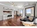 Open-concept living room with hardwood floors, modern lighting, and expansive windows at 2828 Peachtree Nw Rd # 701, Atlanta, GA 30305