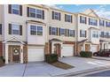 Exterior view of modern townhomes with garages and manicured landscaping at 406 Patina Se # 23, Mableton, GA 30126