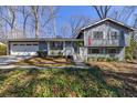 Charming two-story home with blue siding, trimmed windows, and a manicured front lawn at 3594 Vinyard Way, Lawrenceville, GA 30044