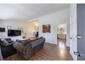 Bright living room featuring modern furnishings, hardwood floors, and an open floor plan at 3594 Vinyard Way, Lawrenceville, GA 30044