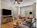 Cozy living room featuring hardwood floors, a bay window seat and ceiling fan at 380 Grant Se Cir # 110, Atlanta, GA 30315
