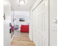 Hallway leading to the living area with hardwood floors and closet at 2161 Peachtree Ne Rd # 405, Atlanta, GA 30309
