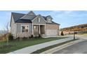 Charming exterior with stone accents, manicured lawn, and a neatly paved walkway at 231 Laurel Vista Dr, Canton, GA 30114