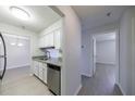 Bright kitchen with white cabinets, stainless steel appliances, and wood flooring at 300 Johnson Ferry Ne Rd # B113, Atlanta, GA 30328