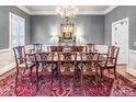 Traditional dining room featuring a chandelier, large table with seating for eight, and gray walls at 708 Collier Commons Nw Cir, Atlanta, GA 30318