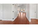 Spacious entryway with gleaming hardwood floors and glass-paneled door at 1602 Renaissance Ne Dr, Conyers, GA 30012