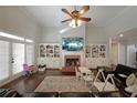 Inviting living room boasts a brick fireplace, built-in bookshelves, and ample natural light at 1023 Spruce Creek Ln, Lawrenceville, GA 30045