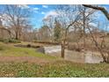 Picturesque backyard featuring a waterfall and stream running through the property at 4144 D Youville Trce, Atlanta, GA 30341