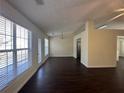 Dining area featuring dark laminate floors, a chandelier and direct access to the backyard at 275 Circle Rd, Dacula, GA 30019