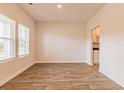 This is a bright and airy living room with wood flooring and lots of natural light at 1587 Sungrown Way, Mcdonough, GA 30253