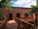 Brick exterior with wooden deck and garden accents at 184 Sw Walker Street # E, Atlanta, GA 30313