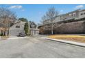 View of multiple homes with a two-car garage and landscaping. Located in a tranquil suburban neighborhood at 3600 Elkhorn Nw Ct, Duluth, GA 30096