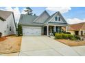 Inviting home featuring a manicured lawn and a two-car garage at 505 Appalachian Woods Dr, Canton, GA 30114