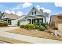 Well-maintained home with lush landscaping and a cozy front porch area at 505 Appalachian Woods Dr, Canton, GA 30114