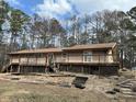 Expansive wooden deck, perfect for outdoor entertaining and relaxation at 8395 Atlanta Newnan Rd, Chattahoochee Hills, GA 30268