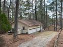 Large garage with multi-car capacity and separate entry door at 8395 Atlanta Newnan Rd, Chattahoochee Hills, GA 30268
